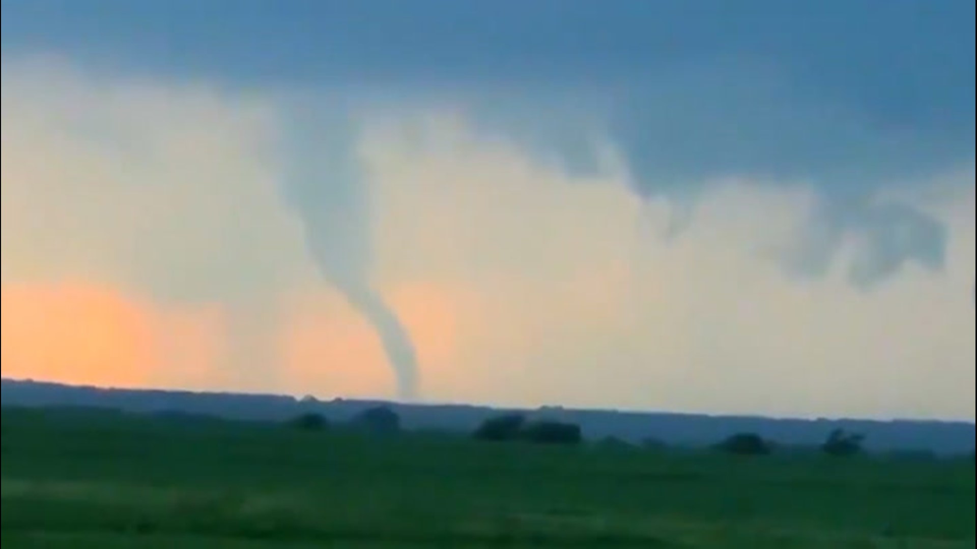 A tornado touched down in Blum, Texas, on Monday, May 3. You can hear the powerful winds in this footage, and see the trees bending from the force of the tornado.