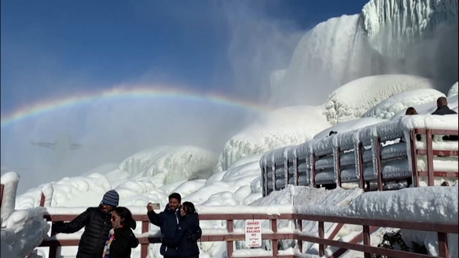 Visitors to the New York side of Niagara Falls were treated to a fun sight as a rainbow formed over the frozen falls on Feb. 21.