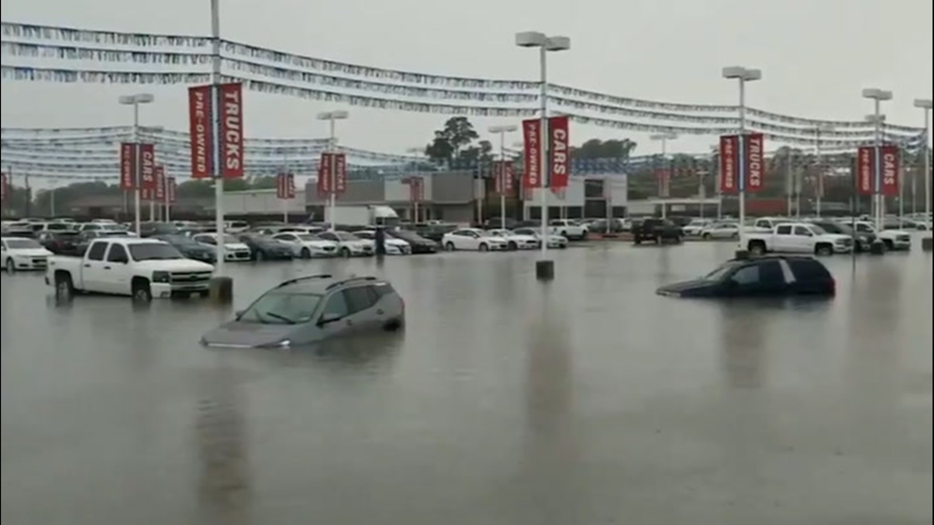 Car dealership underwater after flash flooding