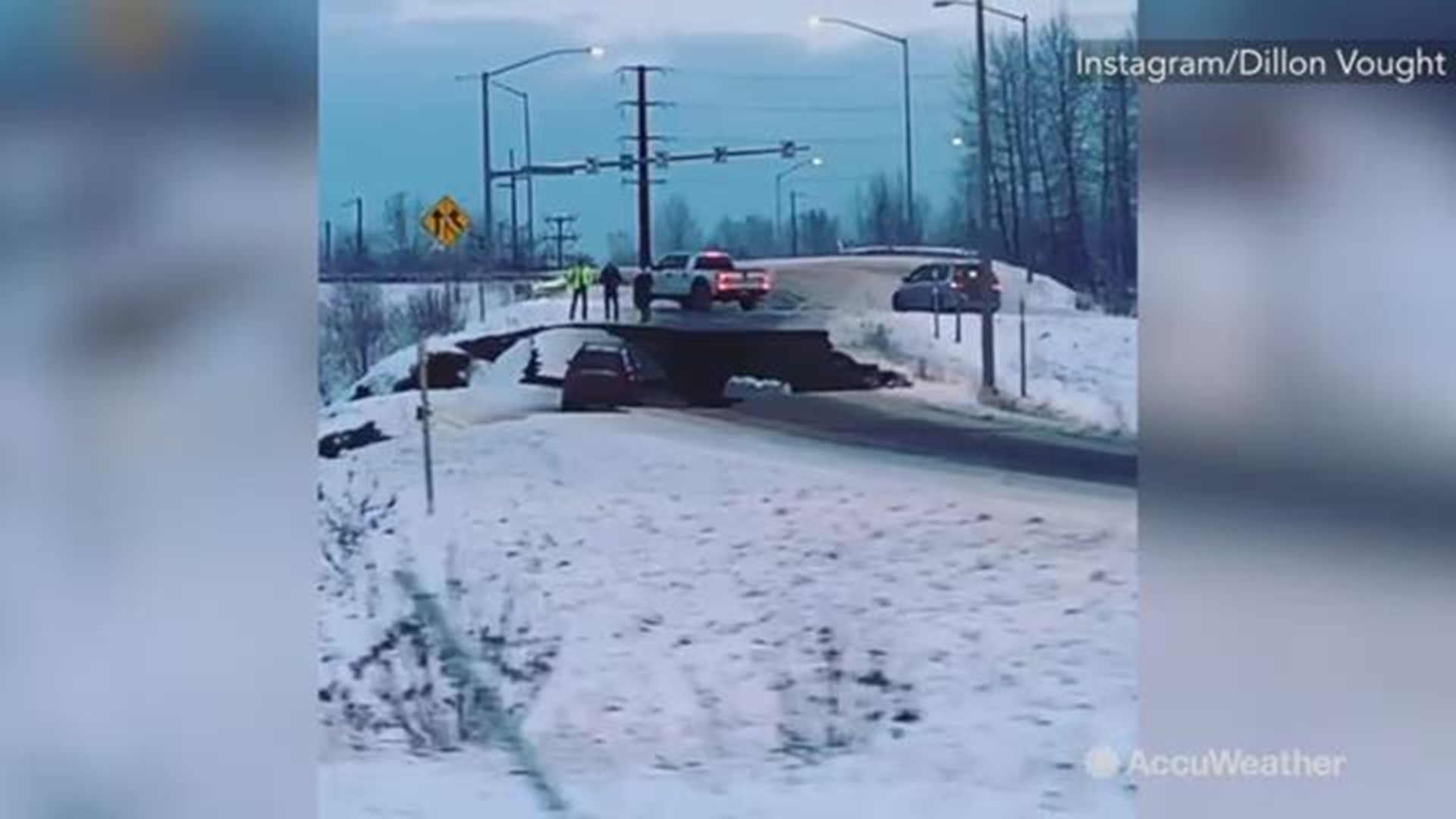 Chunk of road breaks off from earthquake stranding car