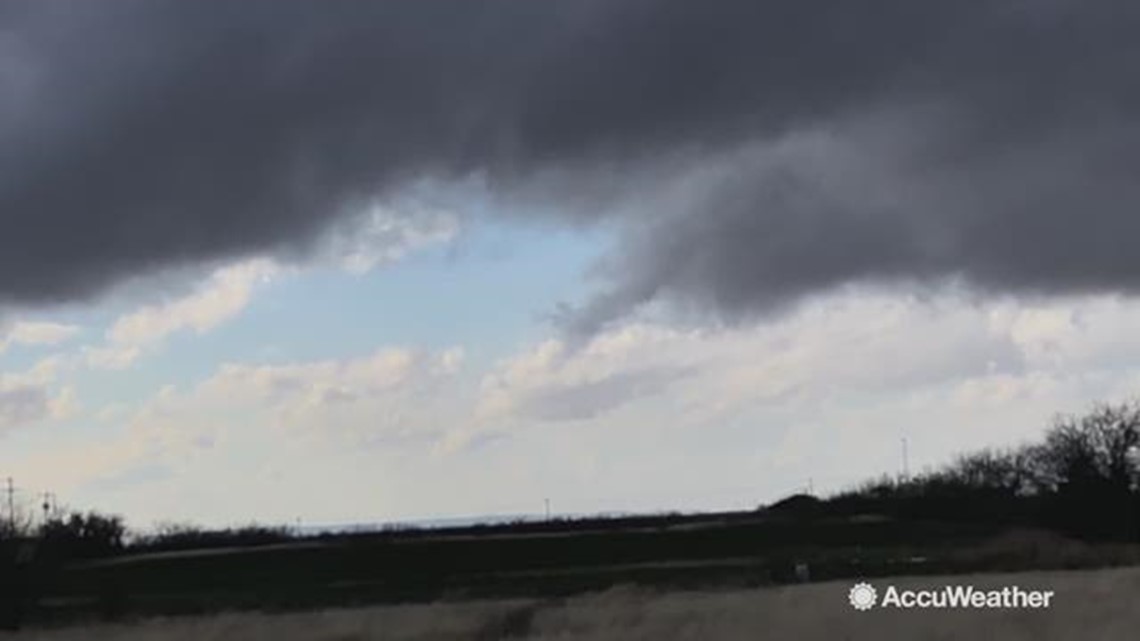 Rope funnel cloud spins above ground