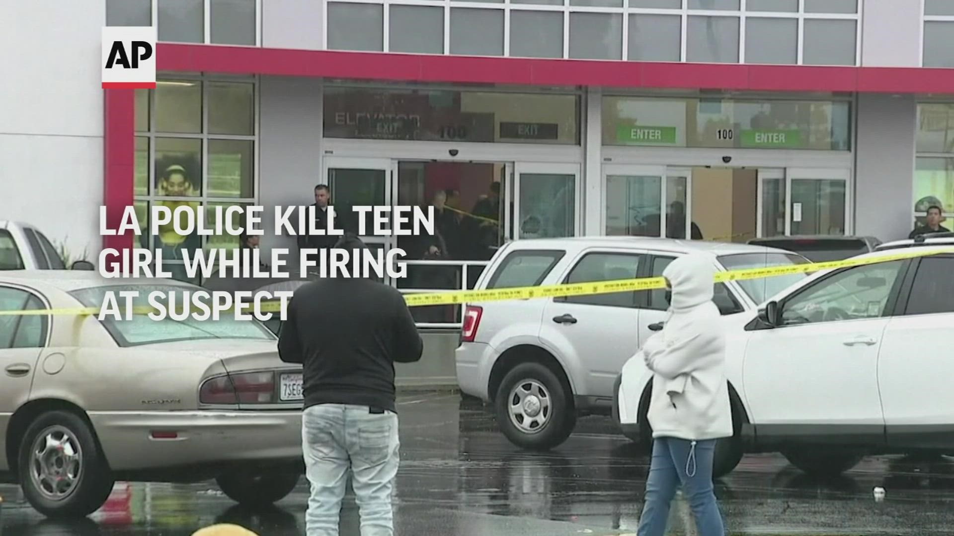 Los Angeles police fatally shot a 14-year-old girl who was inside a clothing store dressing room Thursday as they fired at an assault suspect.