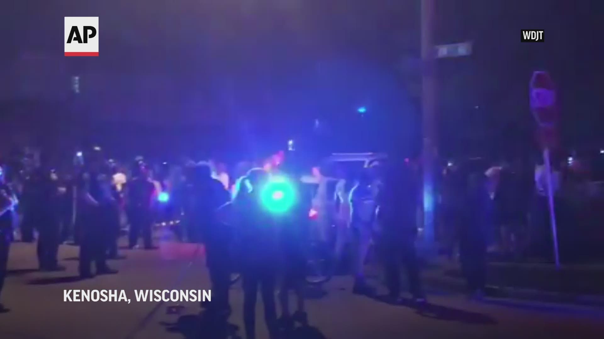 Officers deployed tear gas early Monday to disperse hundreds of people who protested after a police shooting in Kenosha, Wisconsin.