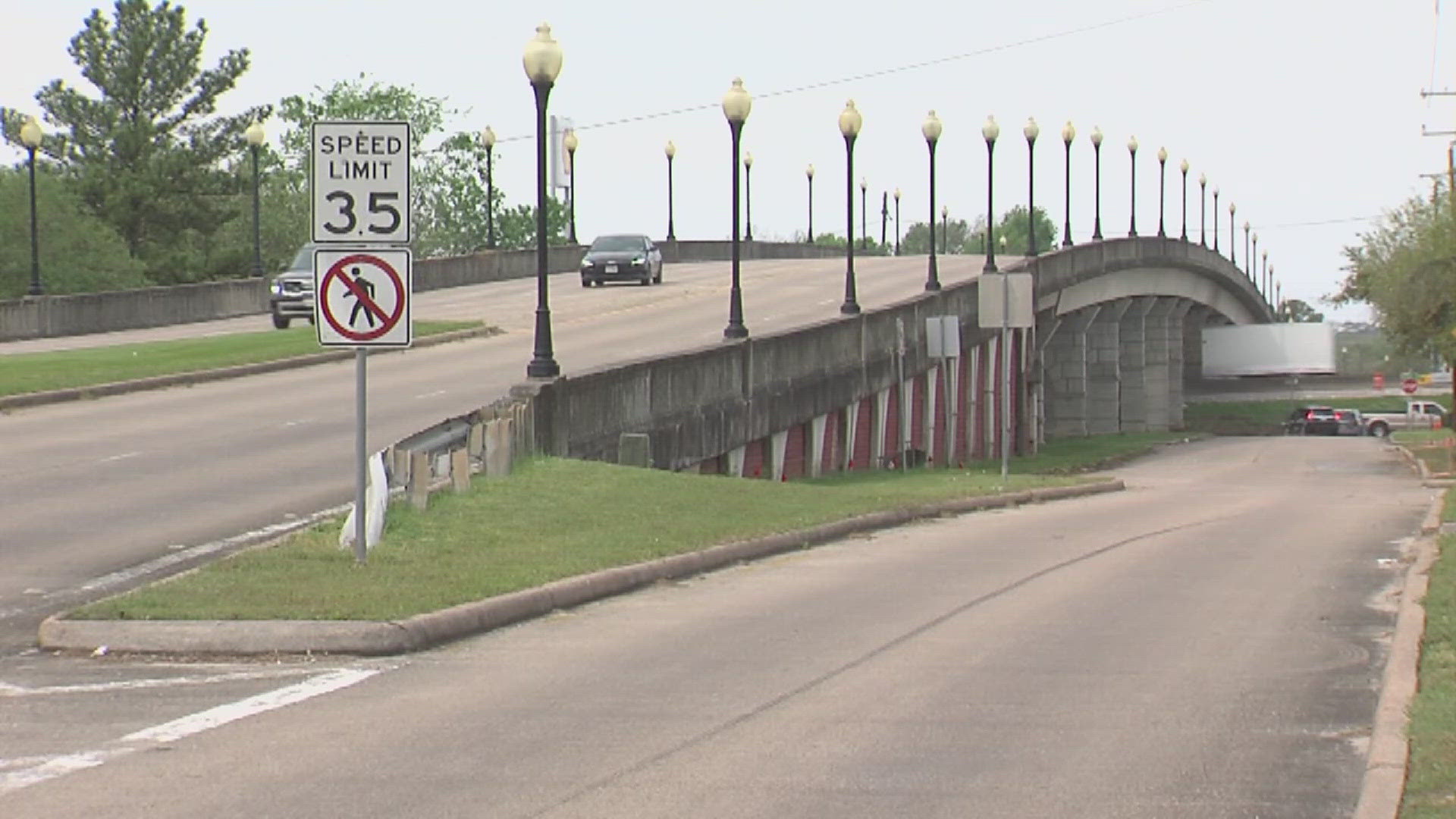 A newly erected sign in front of the bridge indicates that it will be closed April 11, 2025 ahead of the demolition.