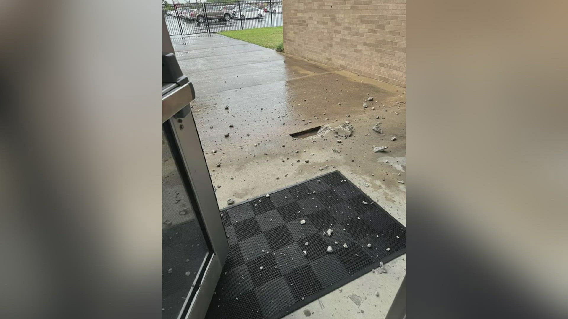 Around 1:13 p.m. it was reported that there was damage to the concrete outside of the school.