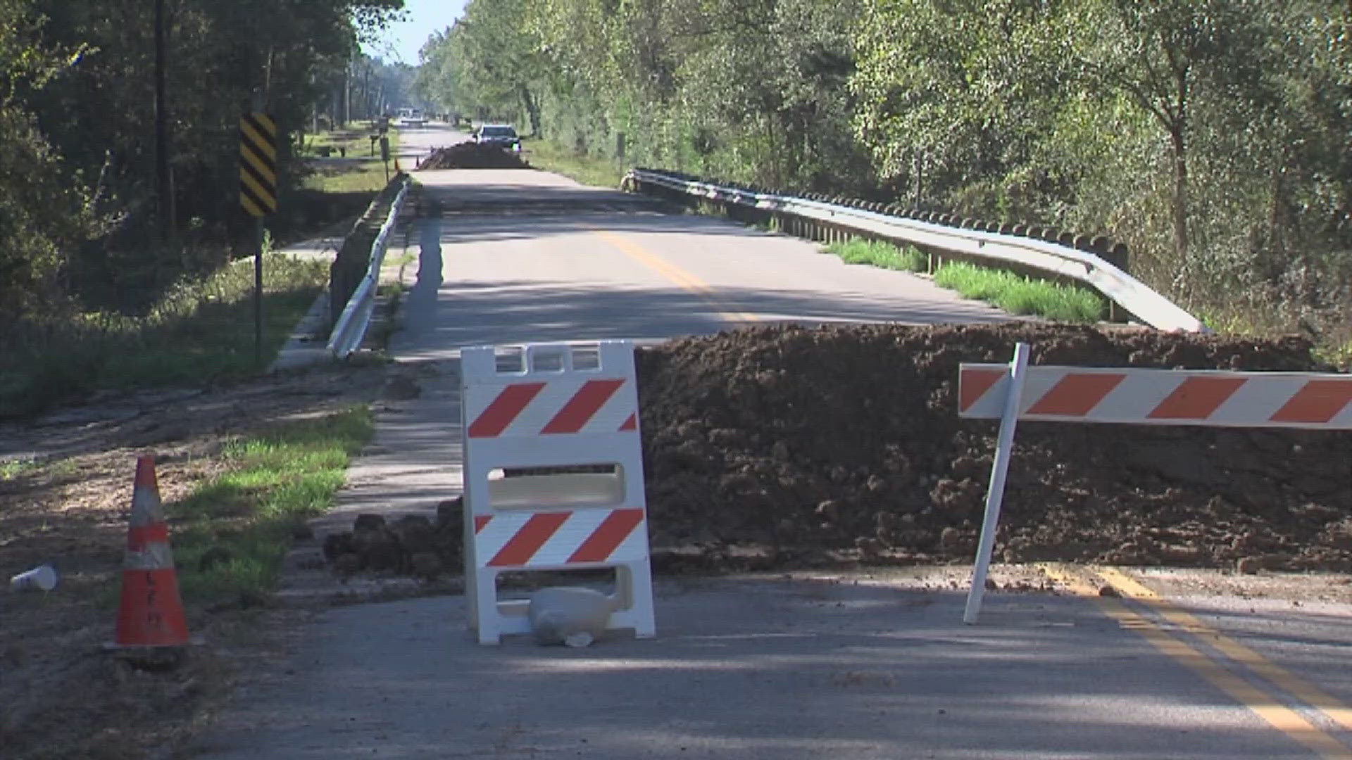 Flood water previously damaged the top layer of asphalt.