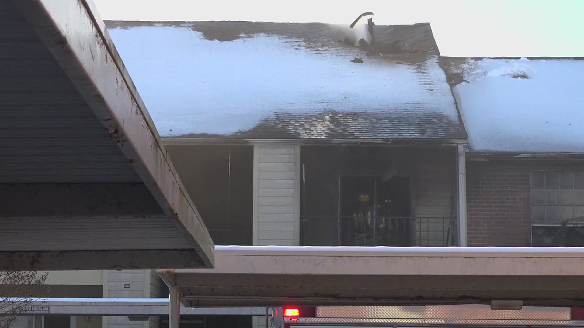 At least two apartments were destroyed in the fire and one person was seen being loaded into an ambulance