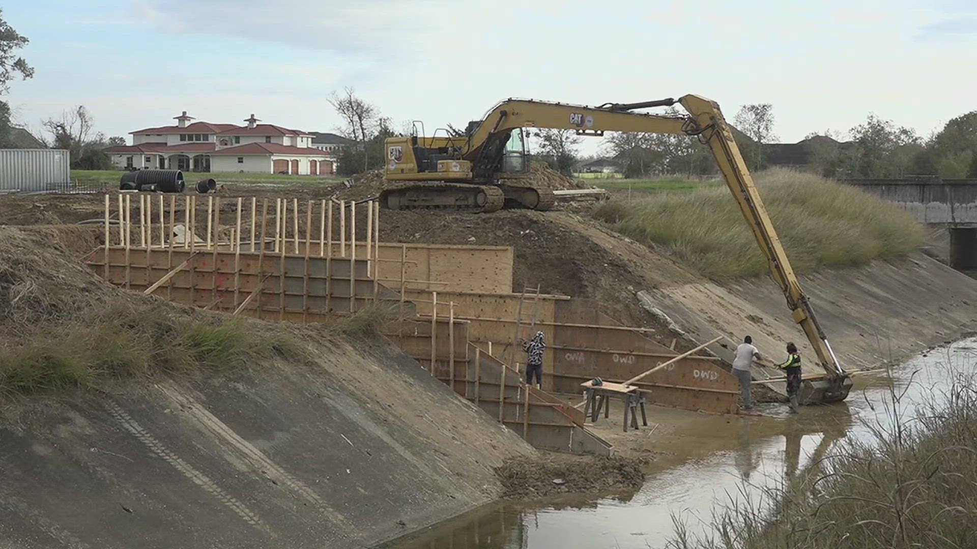 The new channel stretches two miles from the Amelia area to a detention basin off I-10 connected to the Hillebrandt Bayou.