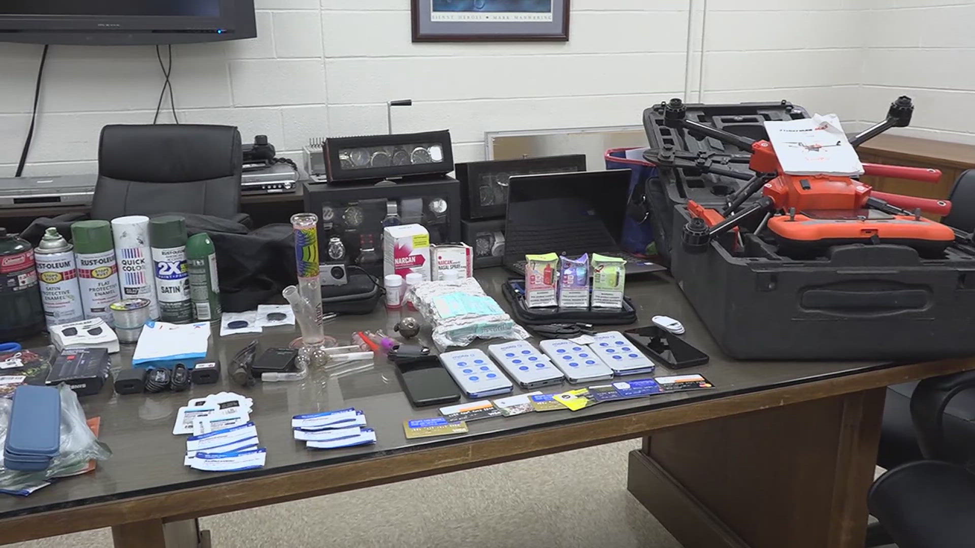 Some of the contraband that deputies confiscated along with the drone includes cell phones, drug paraphernalia, watches, Narcan, spray paint and various electronics.