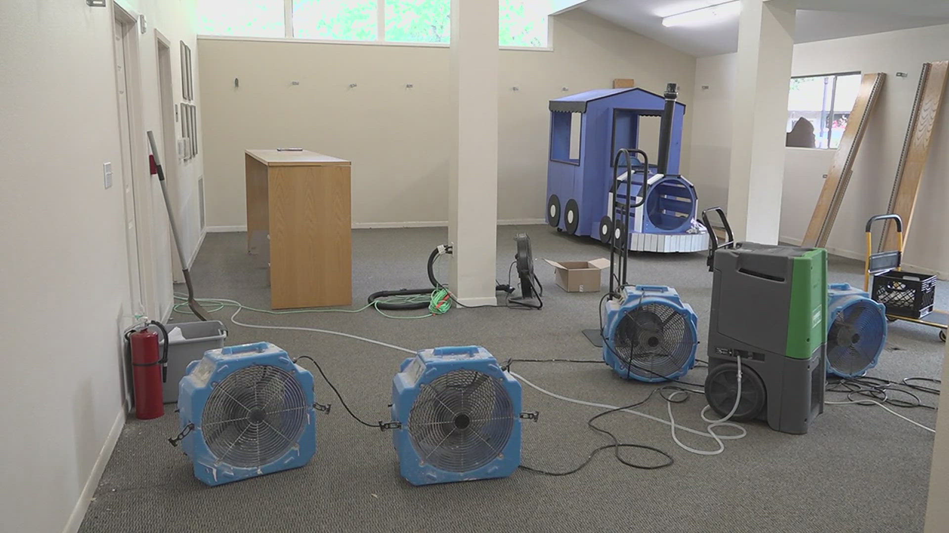 The library lost toys, they had to rip out the carpet and several walls need sheet rock repairs.