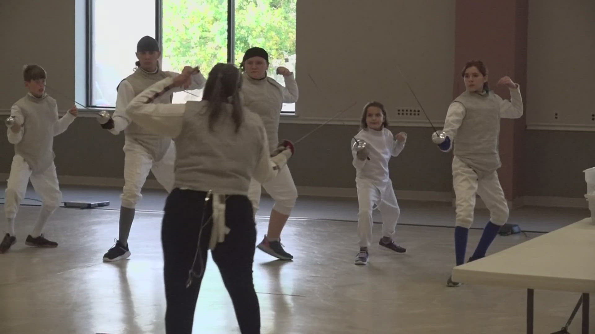 Fr. Sinclair Oubre teaches fencing to Southeast Texas