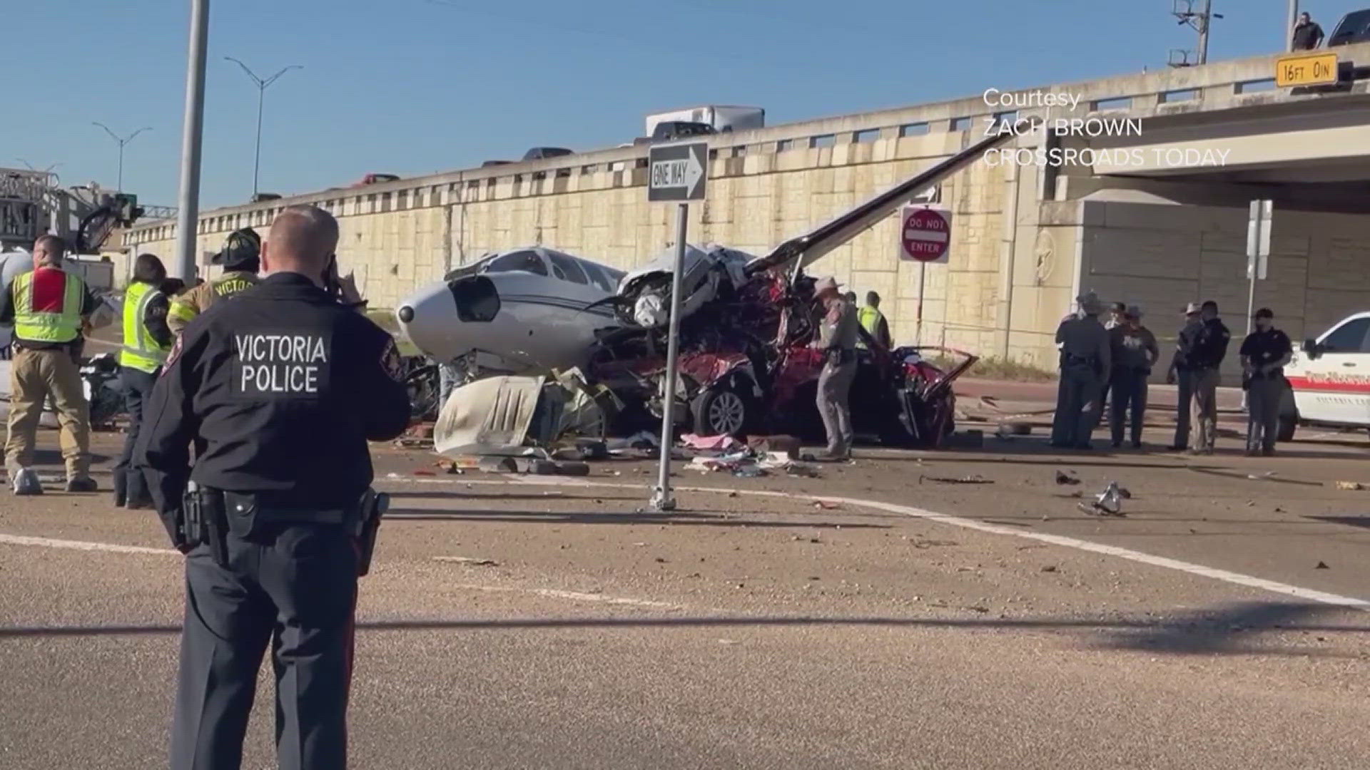 A twin-engine propeller plane crashed onto a highway in Victoria on Wednesday afternoon, splitting in two and leaving debris scattered across the roadway.