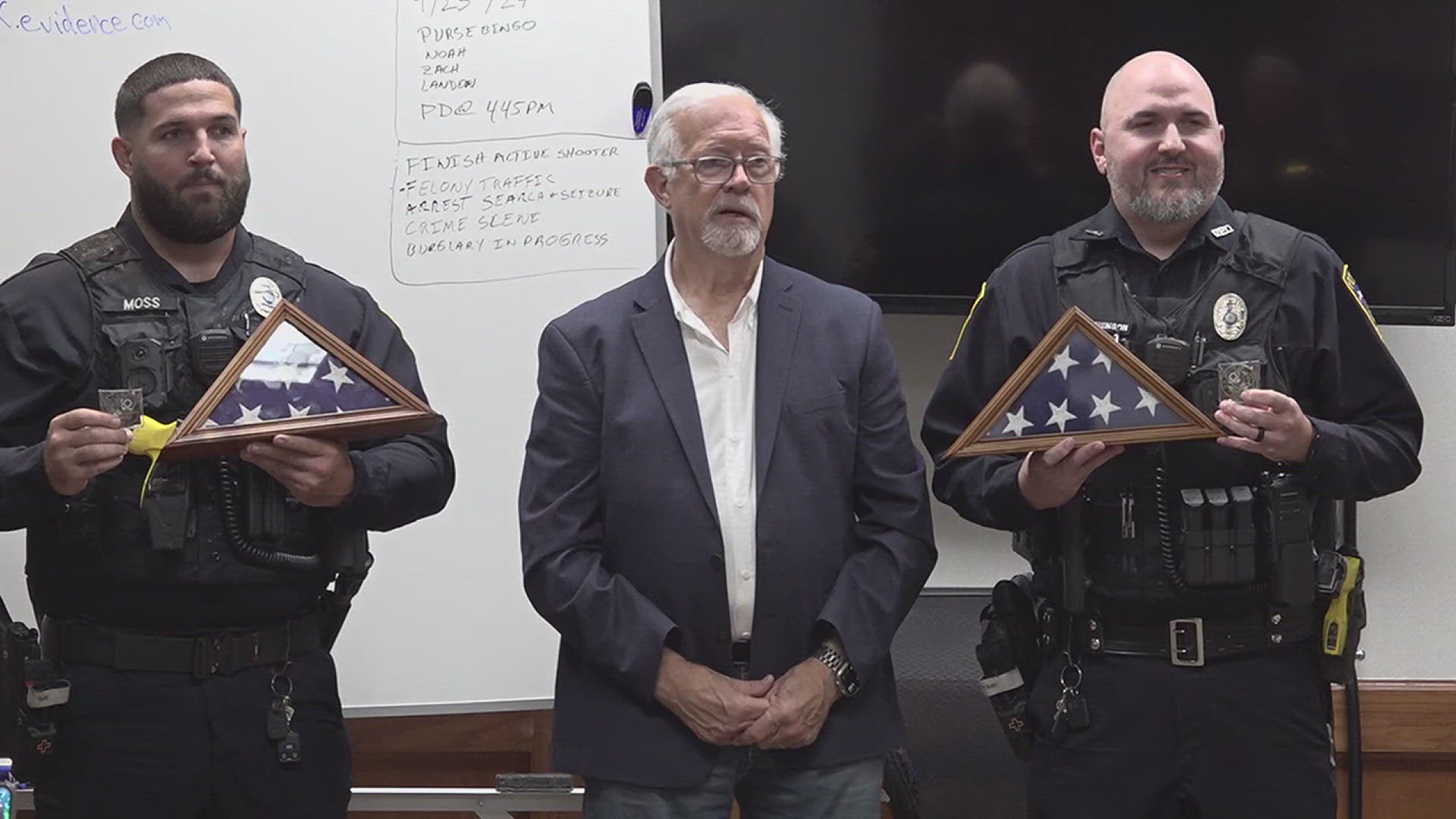 The two officers, Michael Stephenson and Ashton Moss, received congressional medal from Congressman Randy Weber for their life-saving actions.