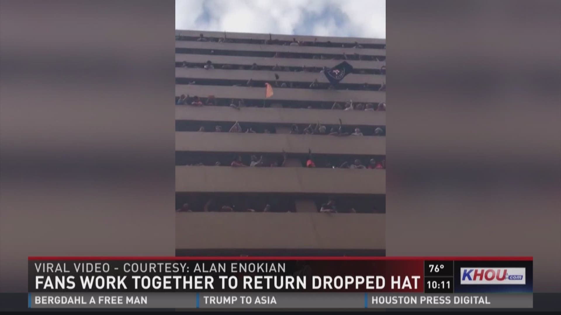 After a woman dropped her hat from a parking garage during the Astros victory parade Friday afternoon, fellow fans helped get it back to her and it was all caught on camera in a now viral video.