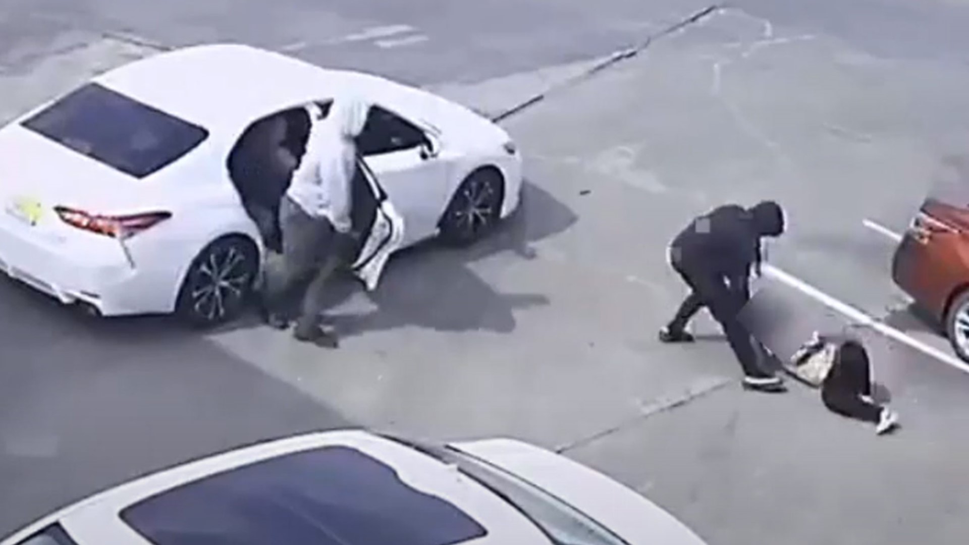 A woman was dragged through a parking lot last month as she held tightly to her purse, and now Houston police have released the video in hopes of making an arrest.