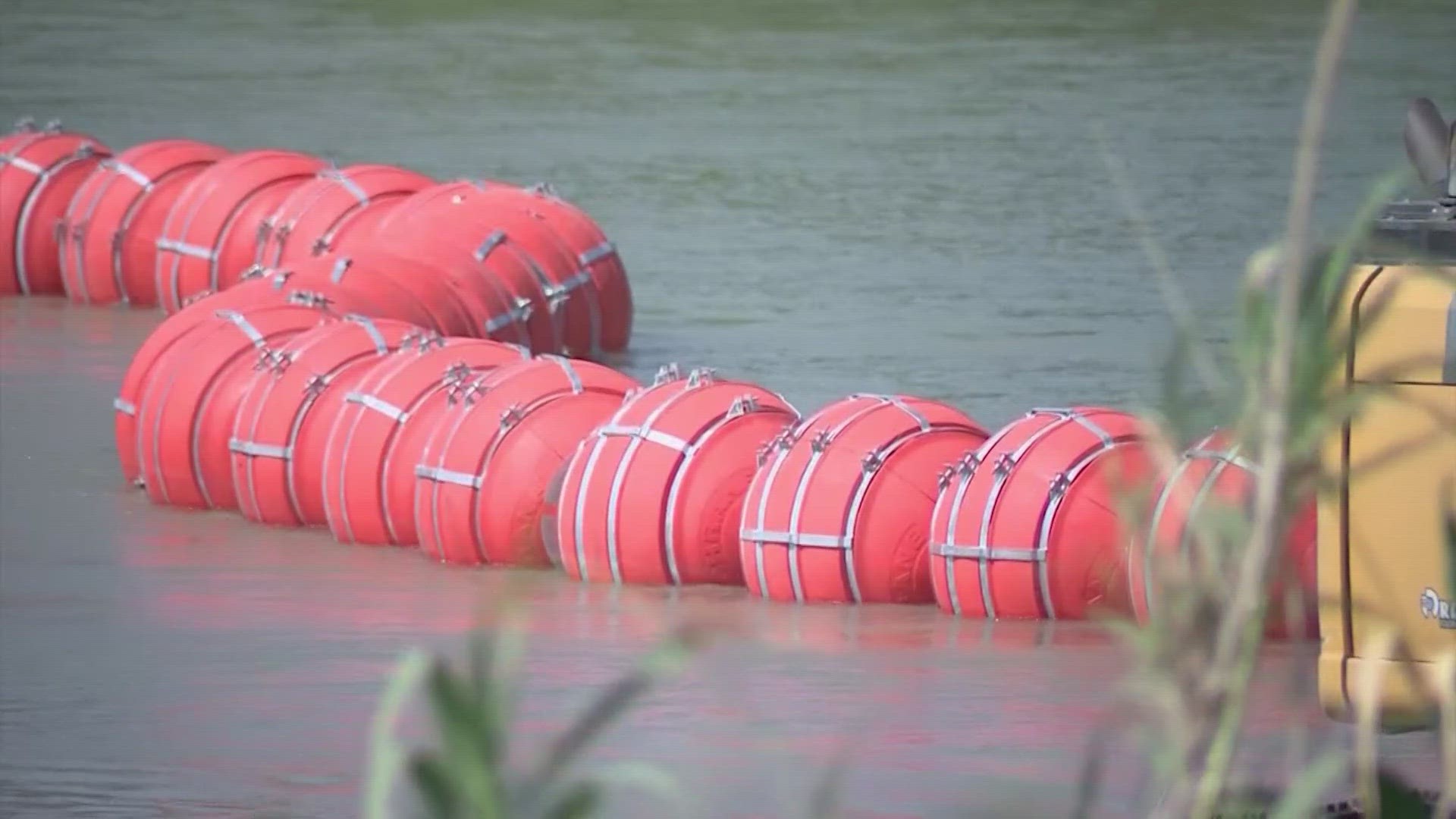 The lawsuit asks a court to force Texas to remove a roughly 1,000-foot line of bright orange, wrecking ball-sized buoys