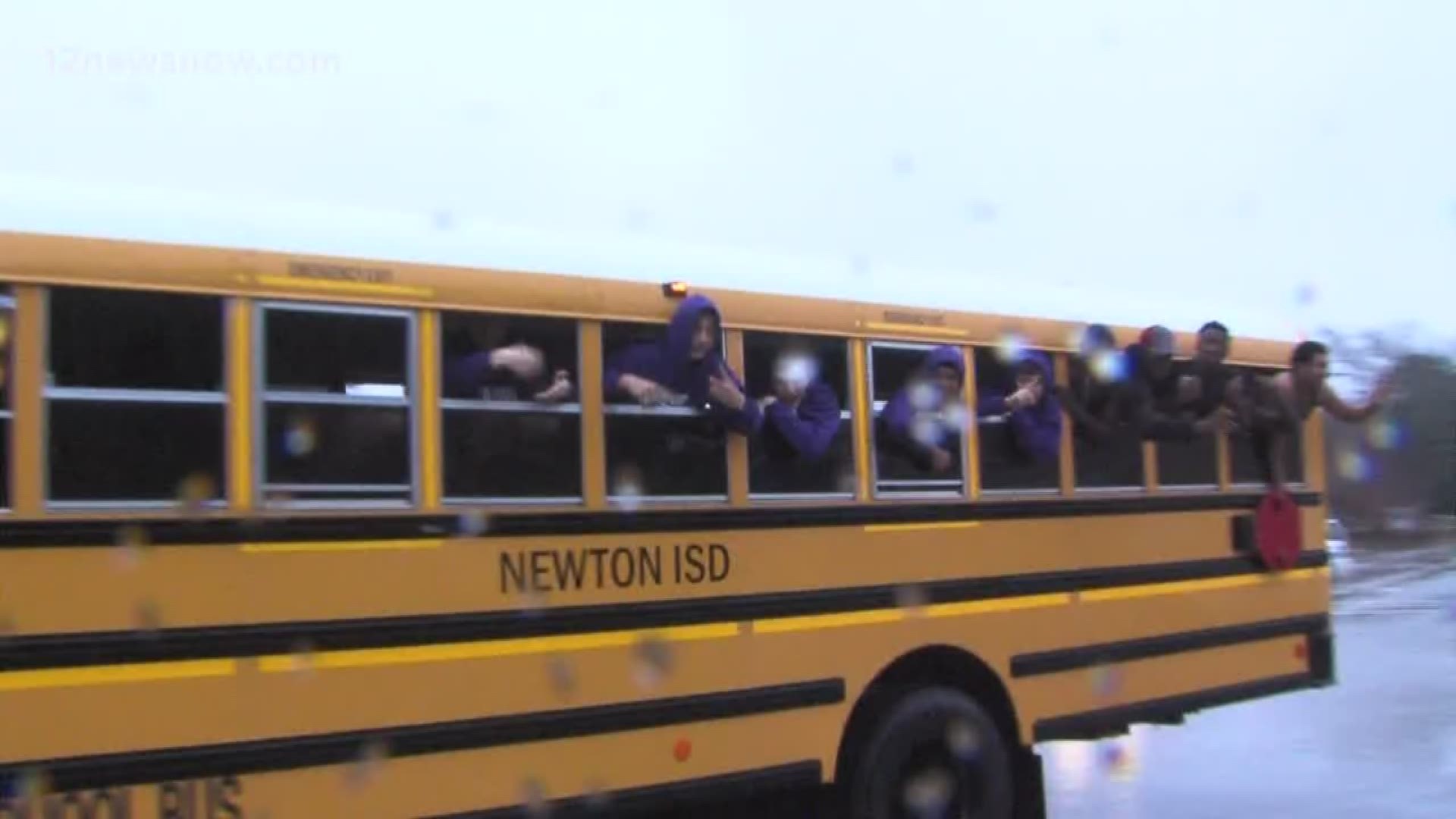 Residents and students gathered on the courthouse square in Newton on Wednesday morning