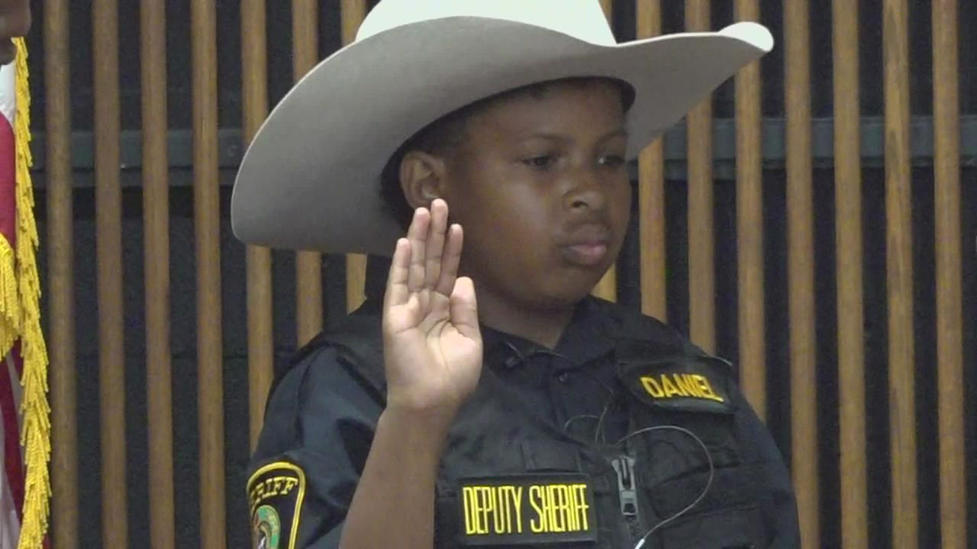 16 different agencies swore in the young officer.