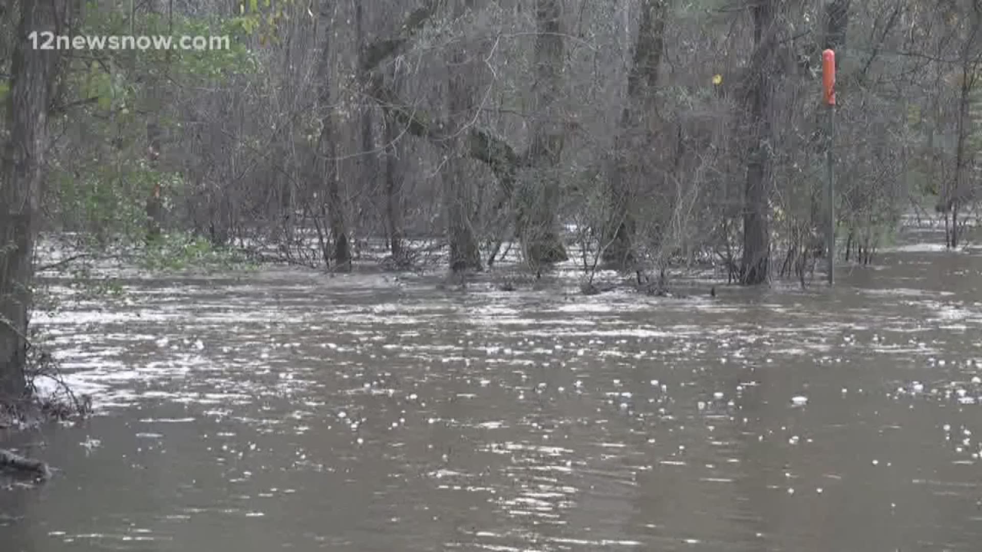 Dozens of families are adapting to water moving over County Road 022 and aren't able to drive home.