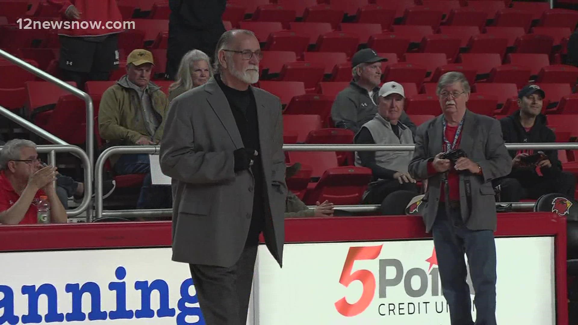 Larry Tidwell recognized as a Cardinal Hall of Honor inductee at women's basketball game.