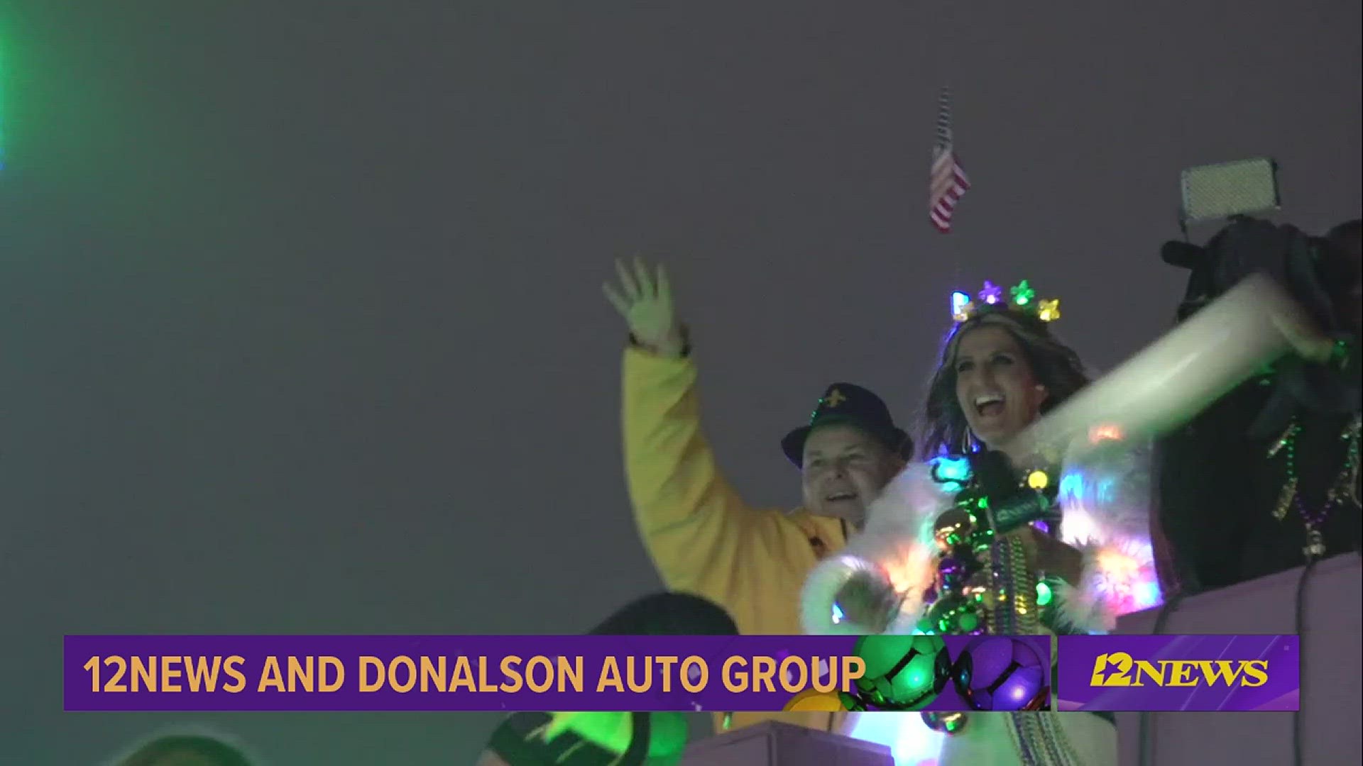 12News peacock float passes by the 12News parade anchor desk as the TotalEnergies Krewe of Aurora Grand Parade rolls through downtown Beaumont