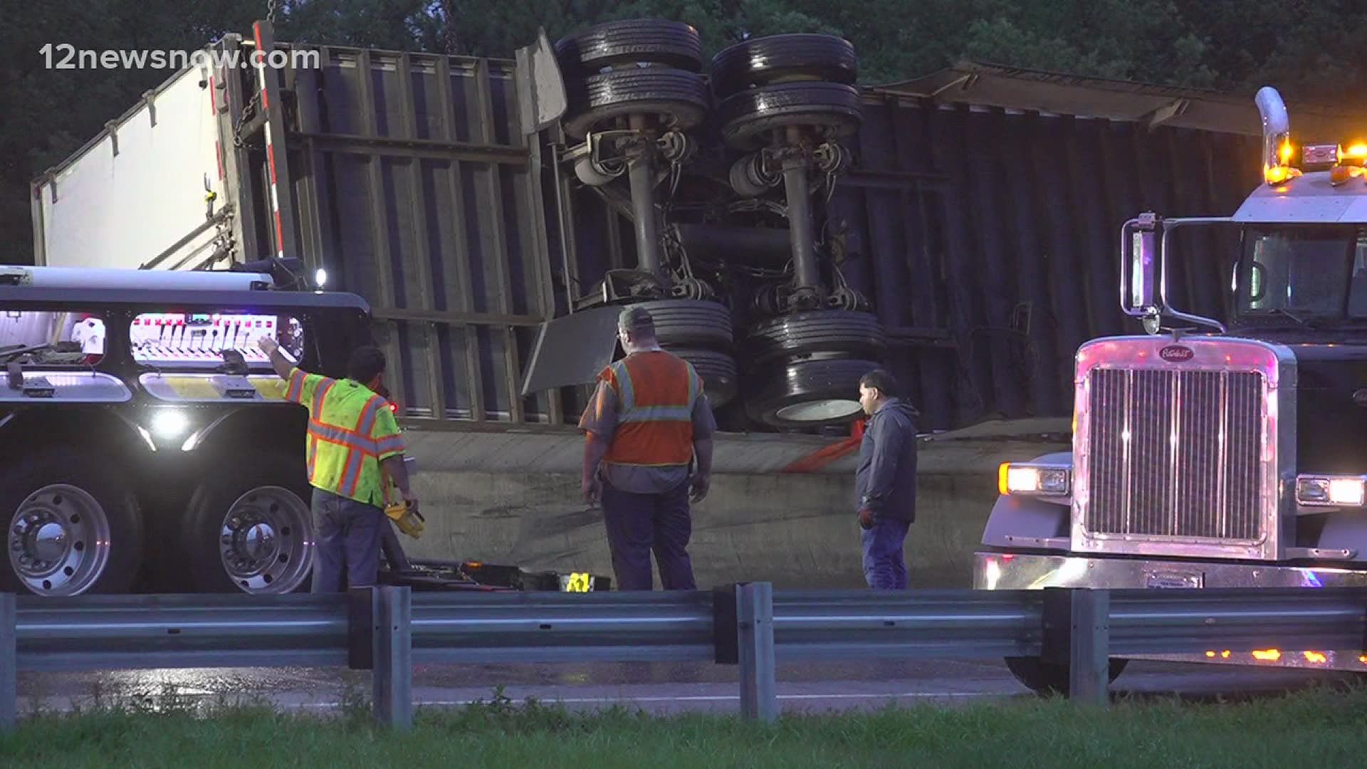 Beaumont officials are working to clean up after an 18-wheeler overturns on Interstate 10 near the 11th street exit.