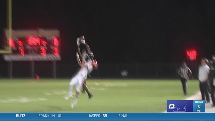 Woodville High School's Ralon Williams connects with Christian Bean in the Play of the Week for week 4