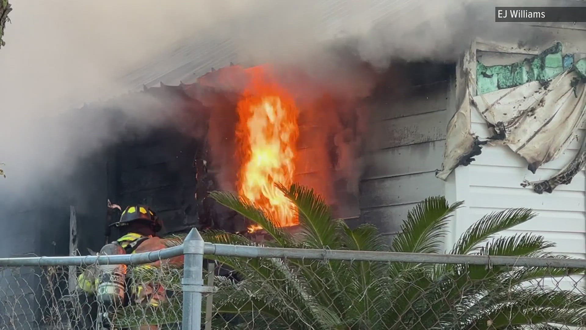 A man who works near the house saw flames coming from the home when he arrived at work.