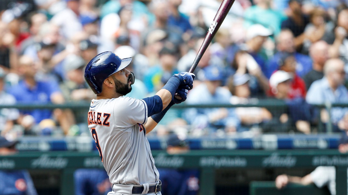 Houston Astros' Marwin Gonzalez watches his solo home run off of