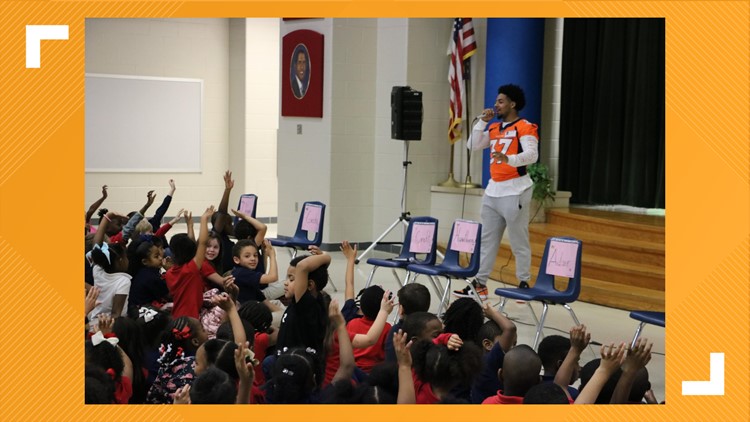 Denver Broncos player P.J. Locke III visits Dishman Elementary