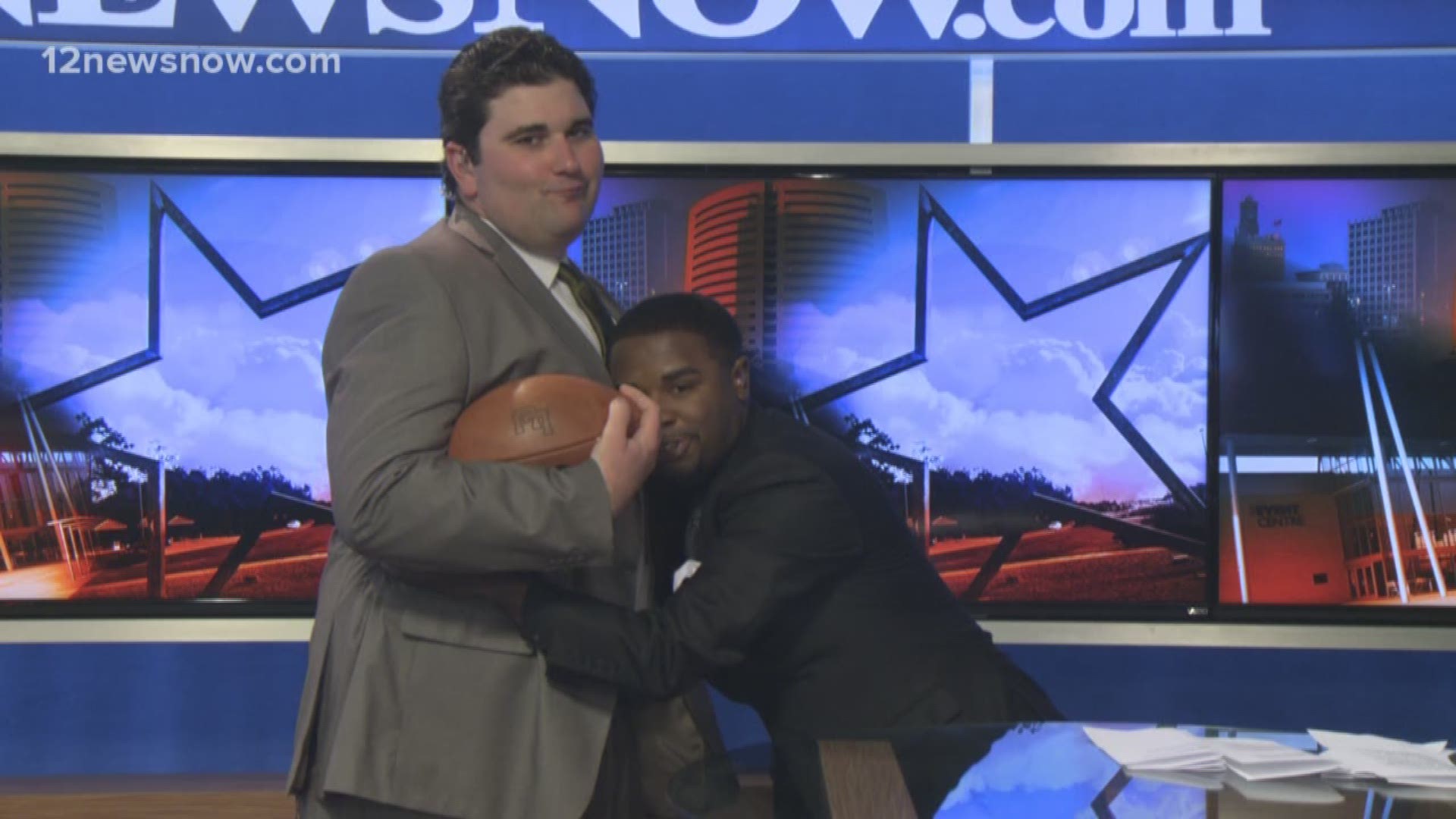 Sports Anchor J Russell Tackles Meteorologist Eric Brill On Live TV