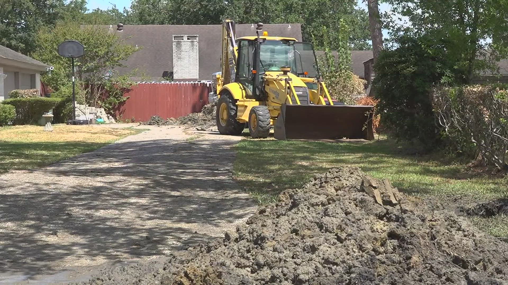 The Whitmires say a few weeks before their sewage issues began, there were workers digging holes near the sewage lines in the neighborhood and behind their home.