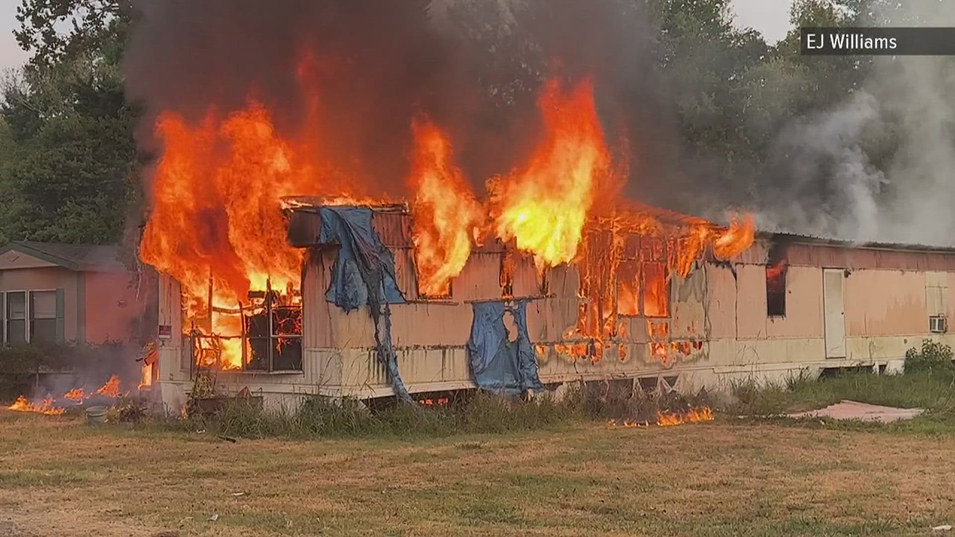 Heavy flames and smoke were coming out of the mobile home as firefighters started to battle the blaze.