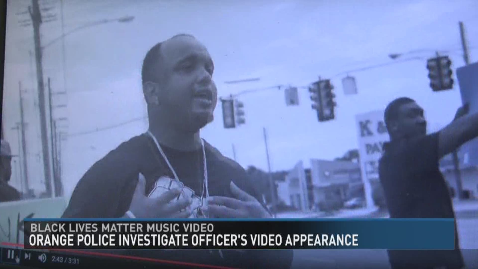 The Orange Police Department is taking a closer look at one of their officer's appearance in a music video that appears to promote the Black Lives Matter movement.