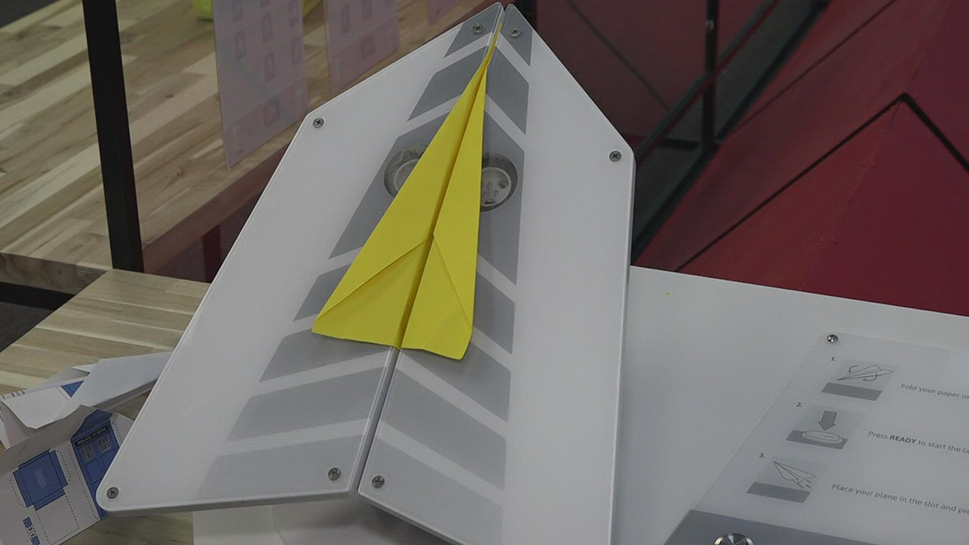 The interactive paper airplane exhibit, called the Launch, was designed by engineering students from Lamar University.