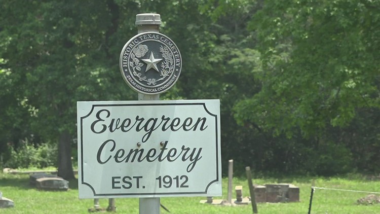 Two black fallen soldiers receiving headstone in Evergreen Cemetery