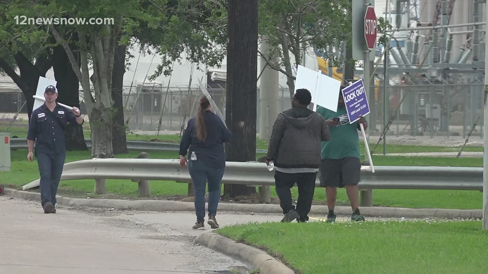 Members of the United Steelworkers Local 13-243 continue to walk a picket line in front of the ExxonMobil refinery in Beaumont on Monday.