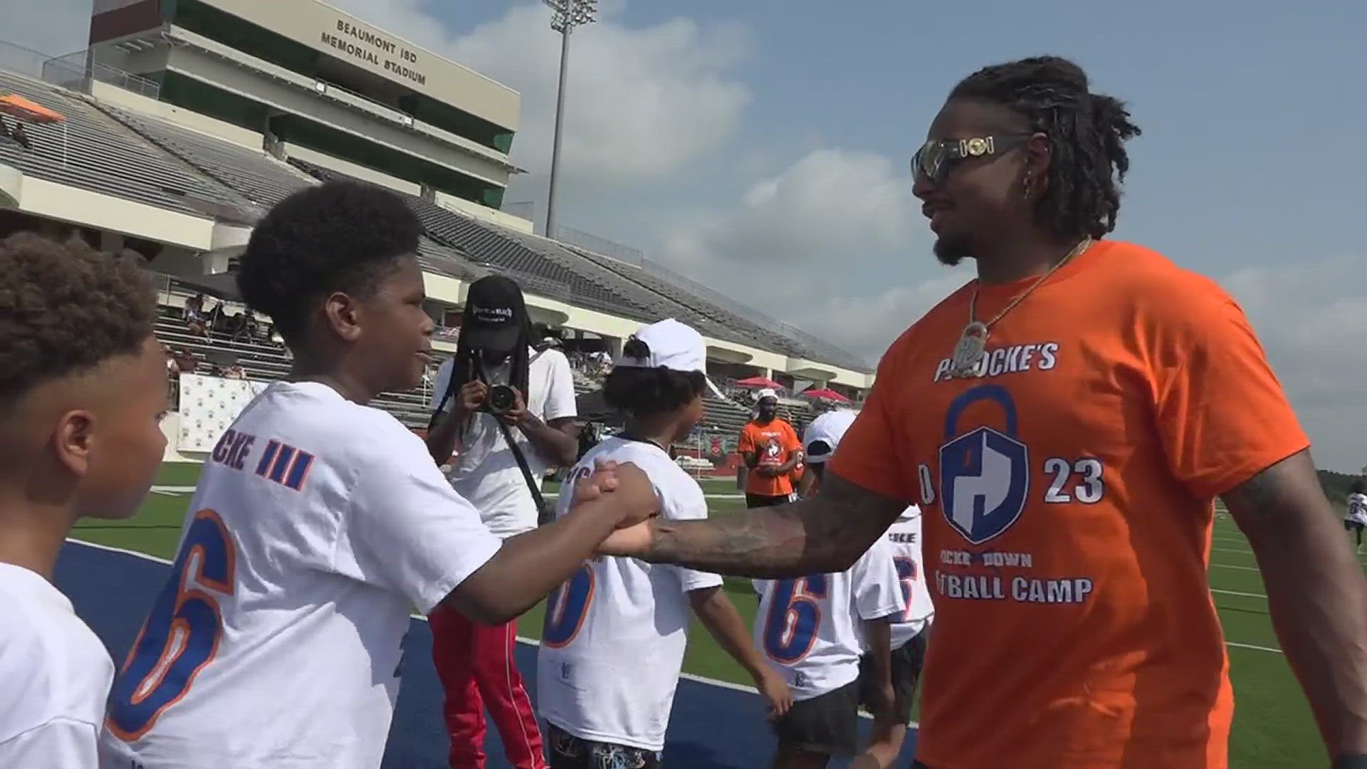 Justin Simmons and PJ Locke of the Denver Broncos run through