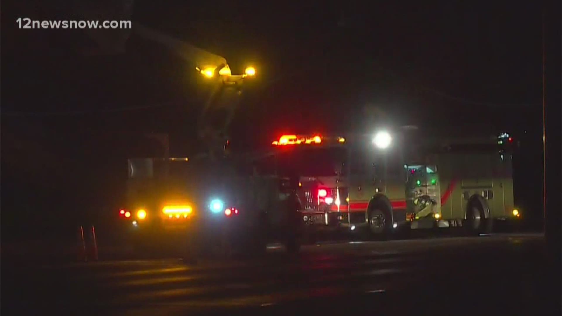 Entergy and Spectrum crews worked in the windy, cold weather Monday night.