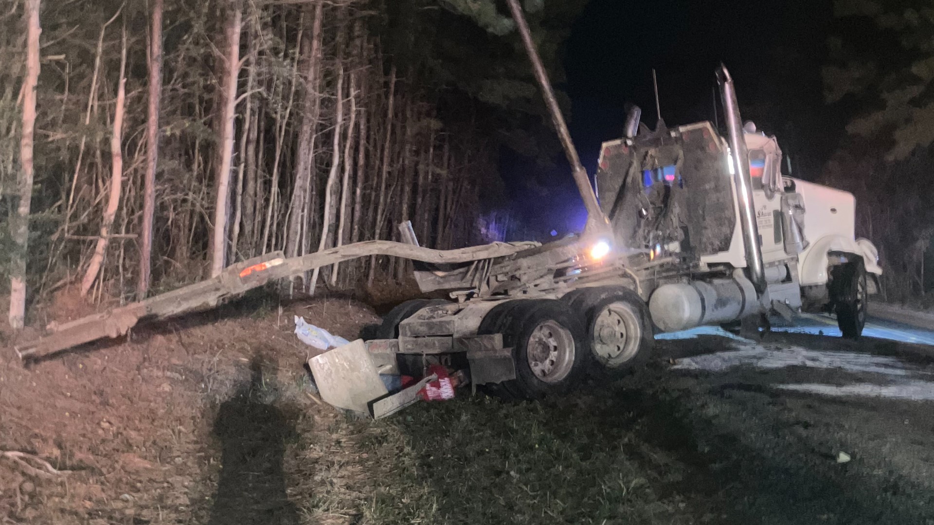 A 58-year-old Woodville man escaped serious injury early Tuesday morning after the logging truck he was driving flipped along a Jasper County road.