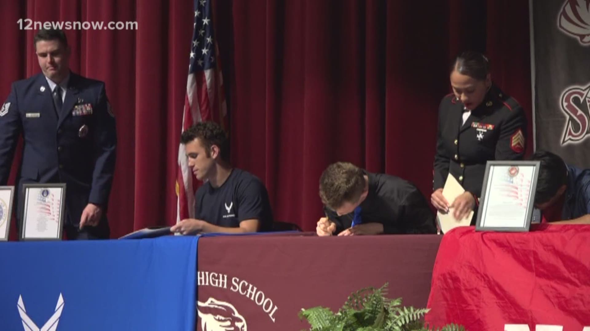 Six students signed commitments at Thursday morning's ceremony.