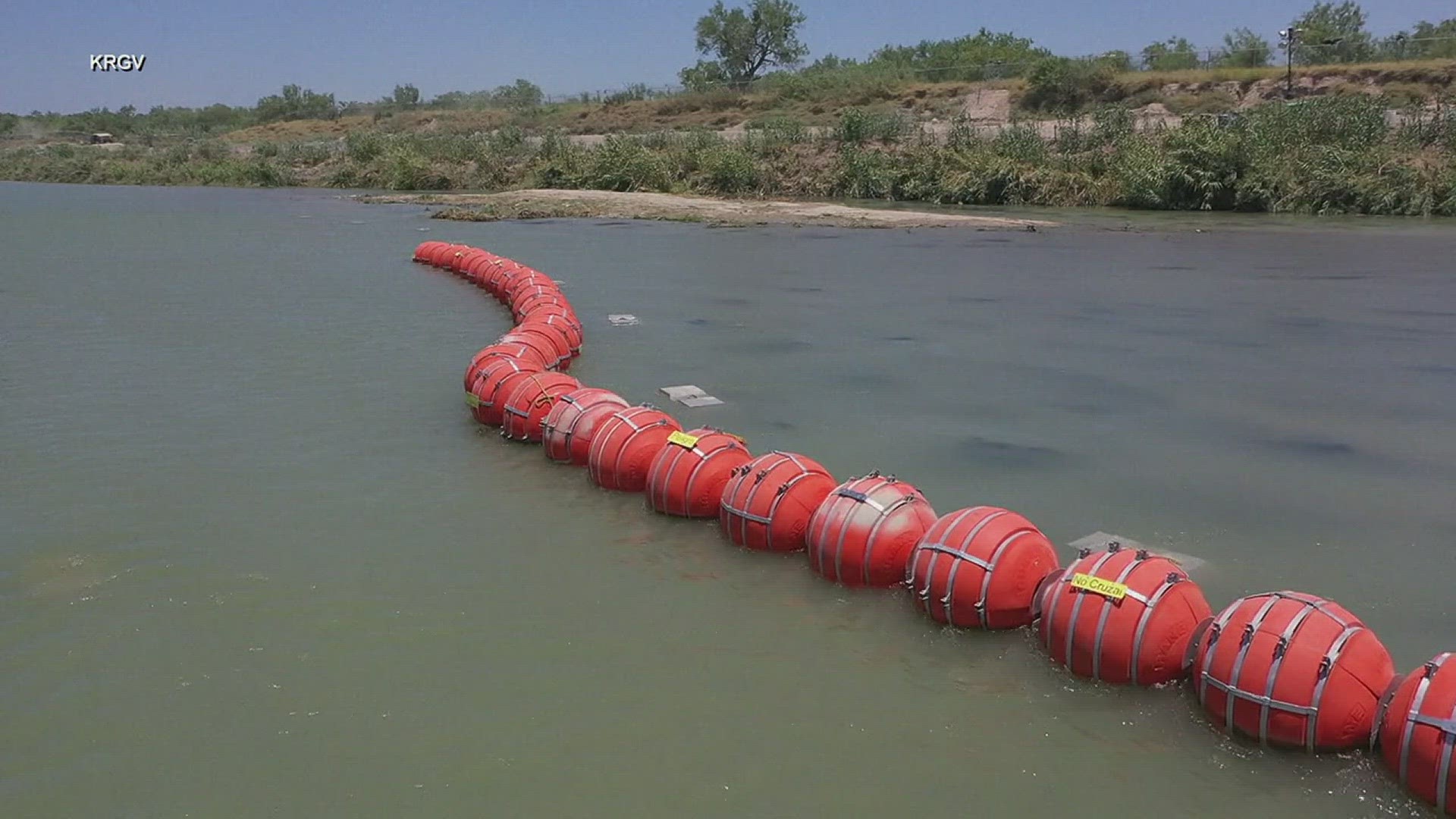 The lawsuit asks a court to force Texas to remove a roughly 1,000-foot line of bright orange, wrecking ball-sized buoys
