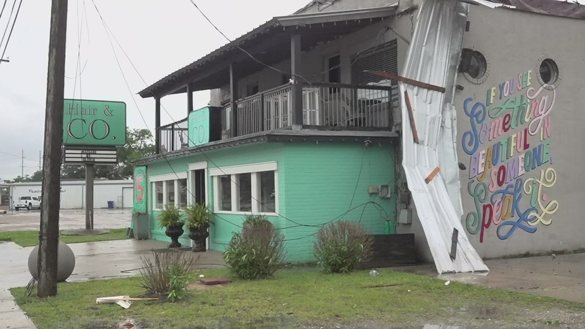 The salon's roof was blown off and water was dripping on the equipment. Owners of the floral shop are worried about their fresh flowers as power is still out.