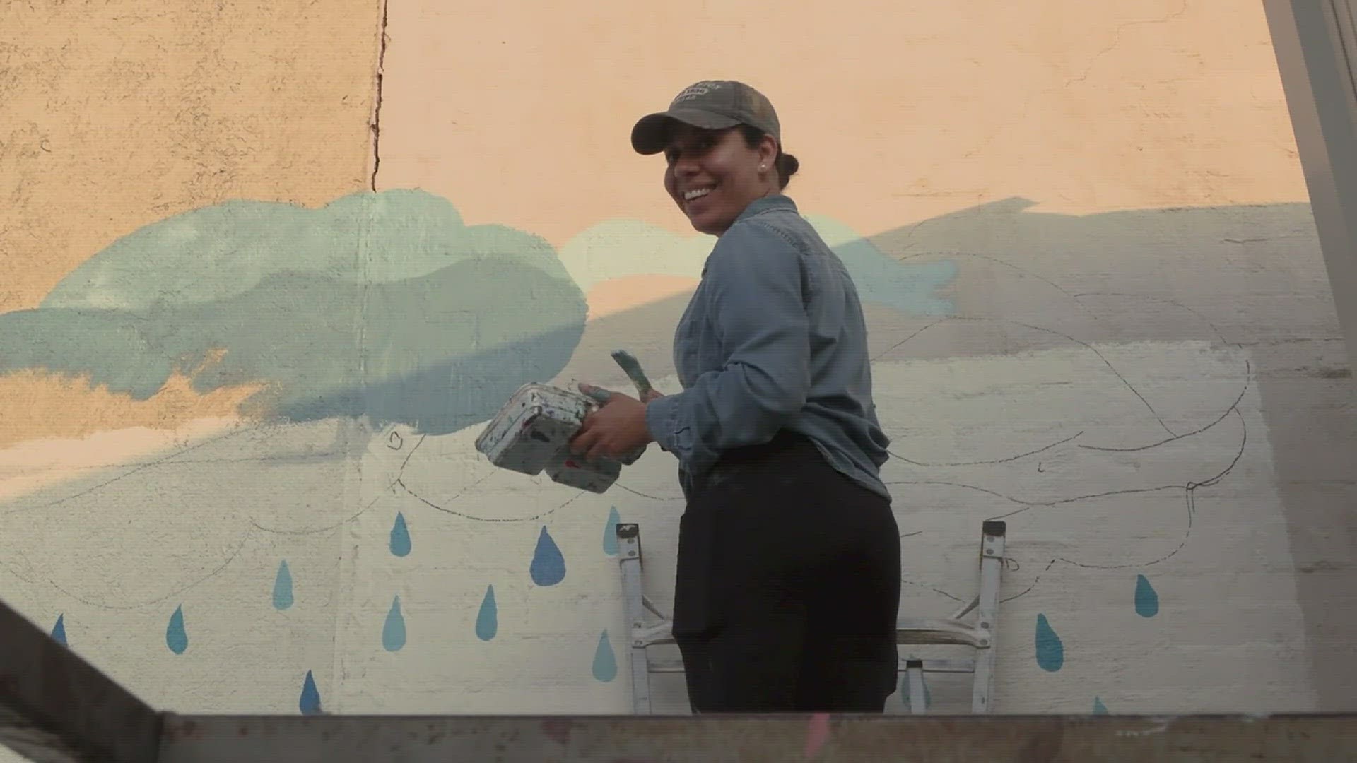 Ines Alvidres painted "Sin Lluvia, No Hay Flores" (No Rain, No Flowers) on a building on Calder Avenue in July 2022.