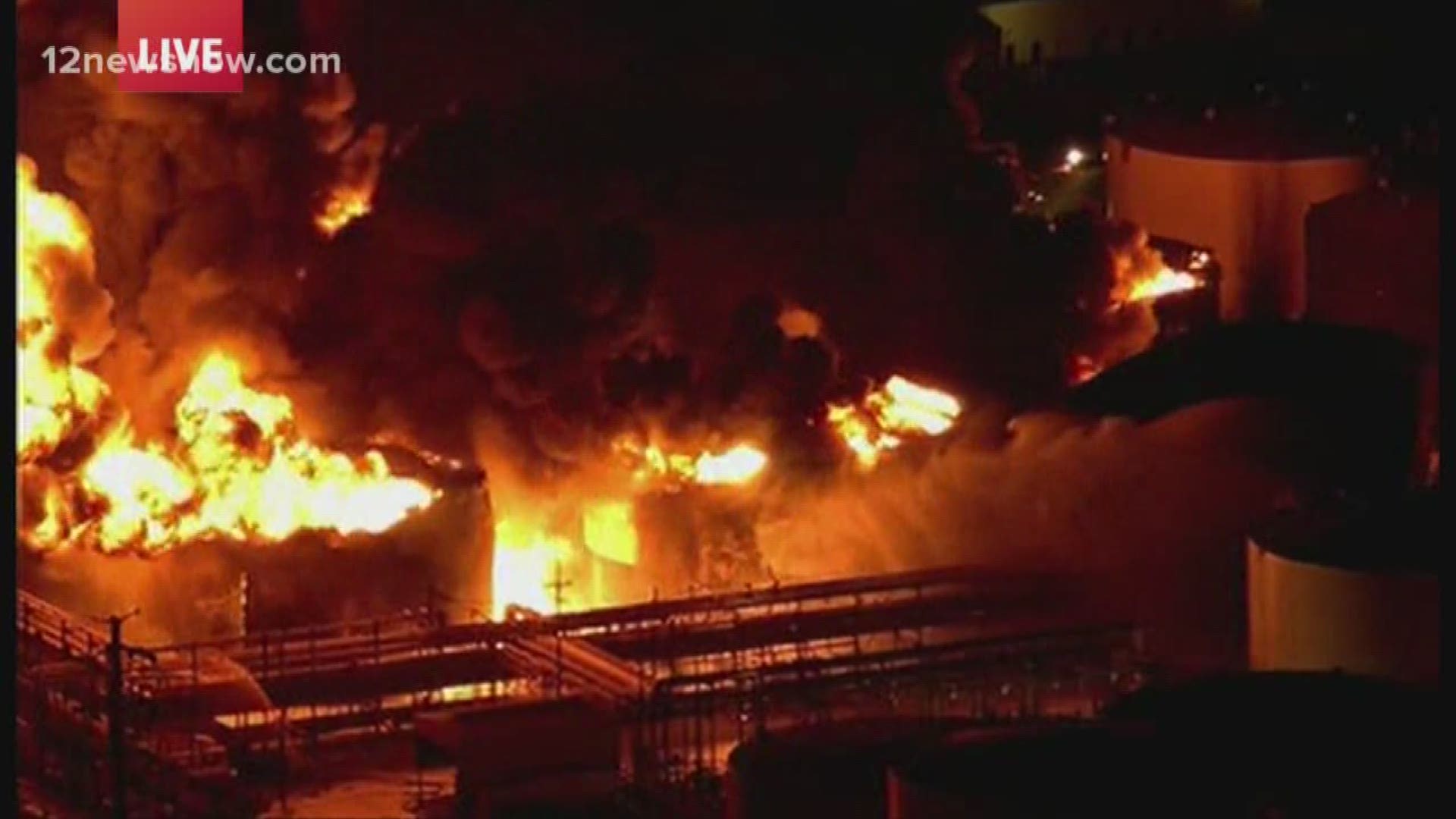 Officials say the tanks will continue to burn for at another day.