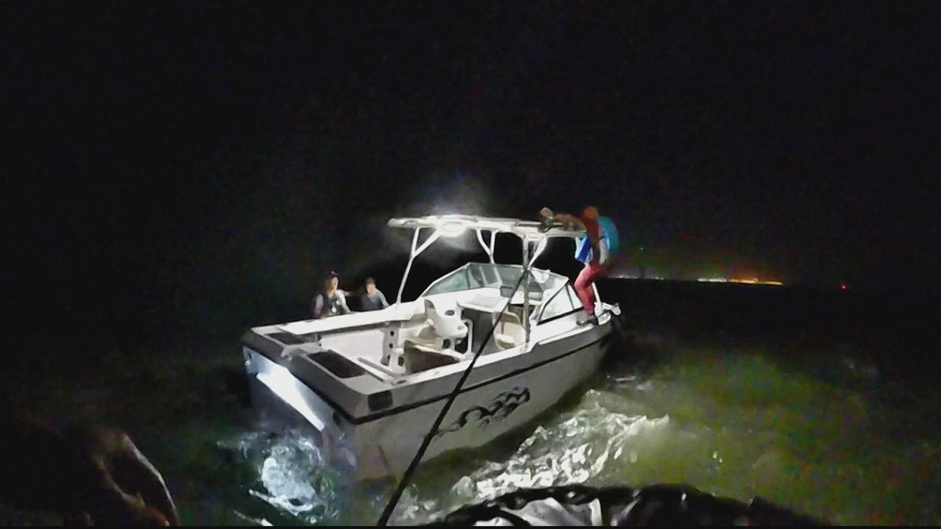 Deputies found three men standing on the jetties near their boat. Because of the strong waves and winds, the boat was partially up on the rocks.