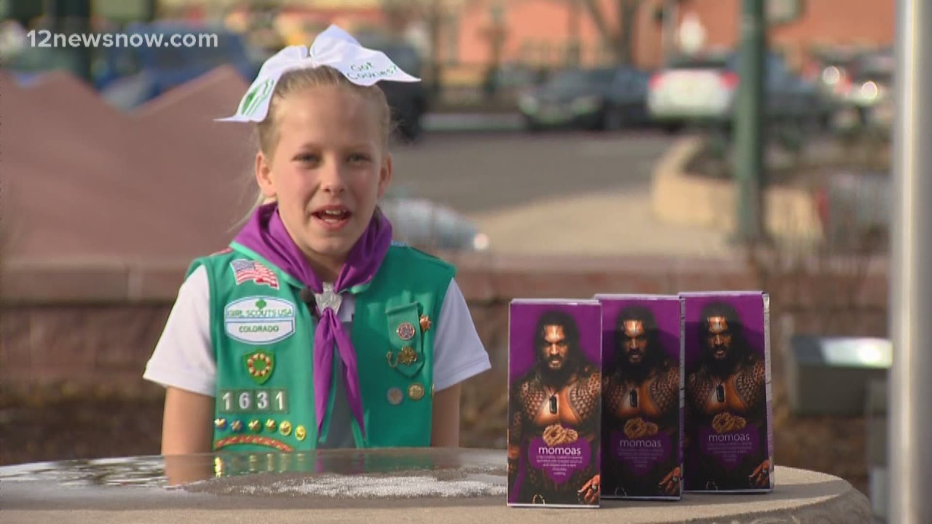 Charlotte and her mother got to work printing out the pictures of Jason Momoa and gluing them on dozens of boxes of girl scout cookies.