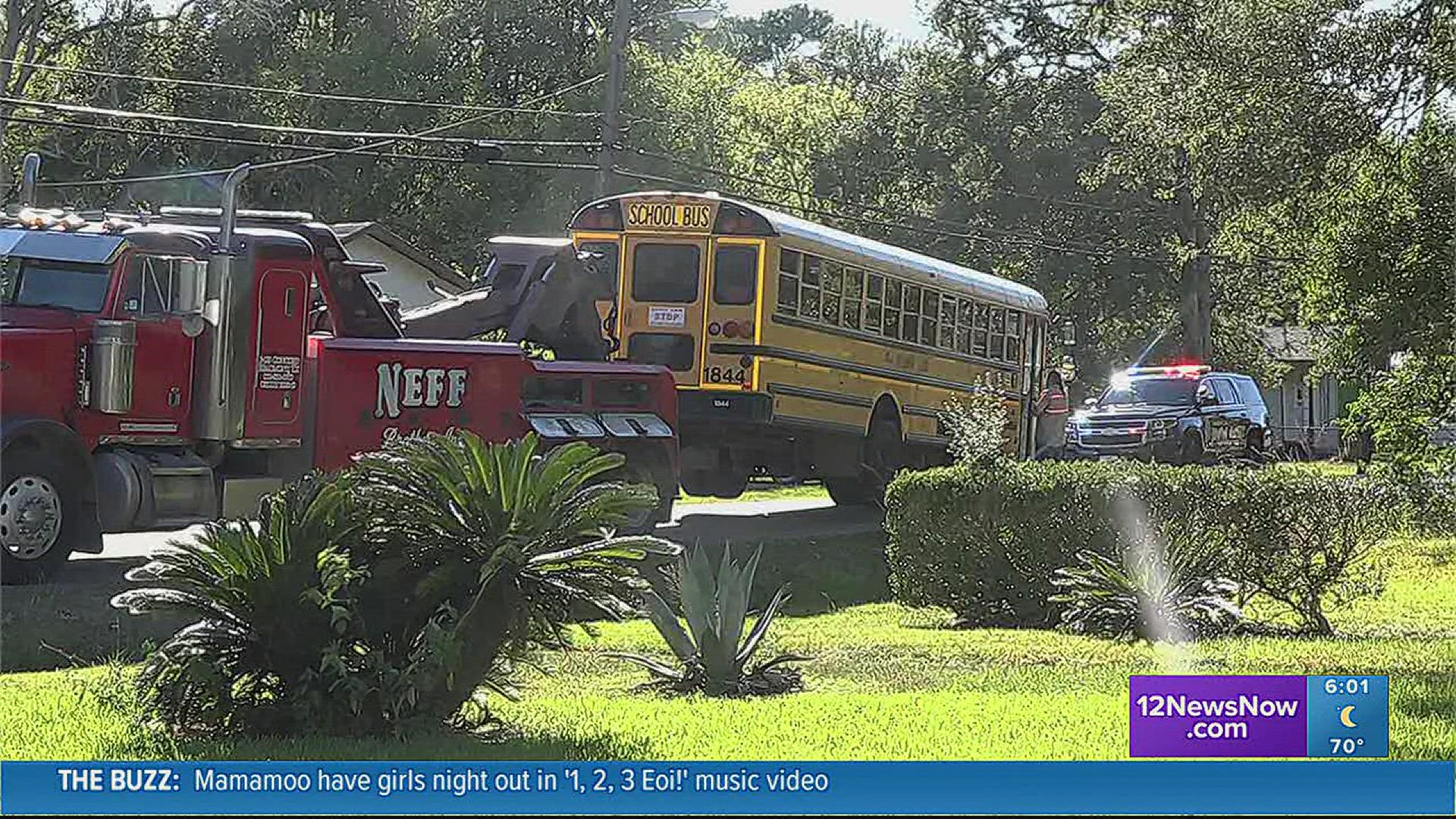 Officials at the scene say the driver of the car failed to stop at a stop sign and crashed into the school bus.