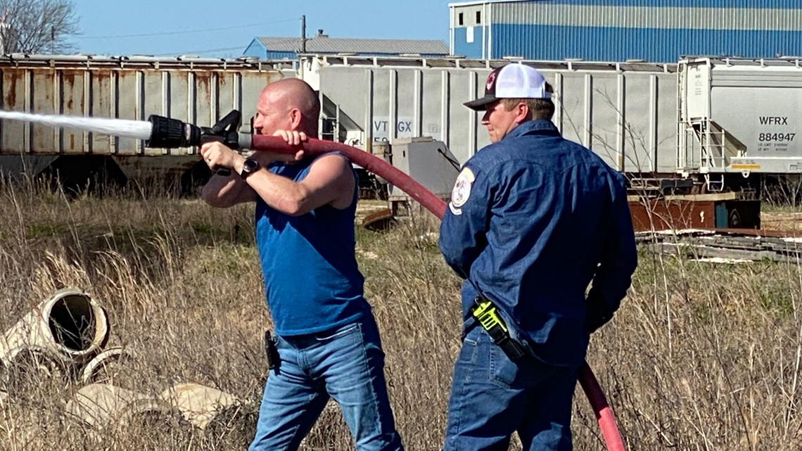 Fire crews working to fight 'out of control brush fire' at rail yard in ...