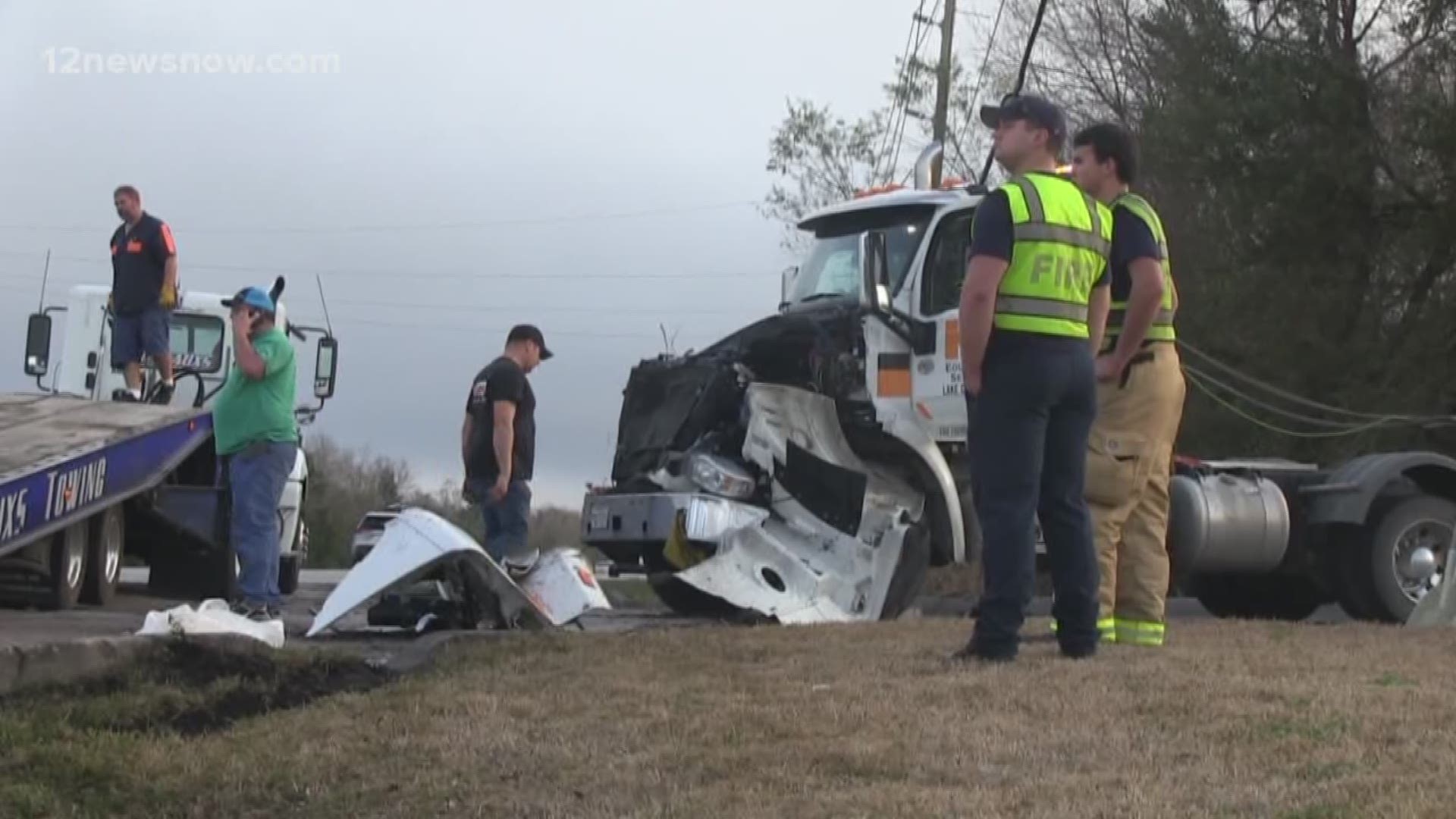 The driver lost control and ended up on the hood of an 18-wheeler.